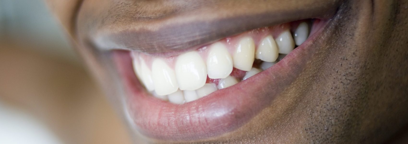 extreme-close-up-of-african-man-s-smile-2026-01-11-09-58-38-utc